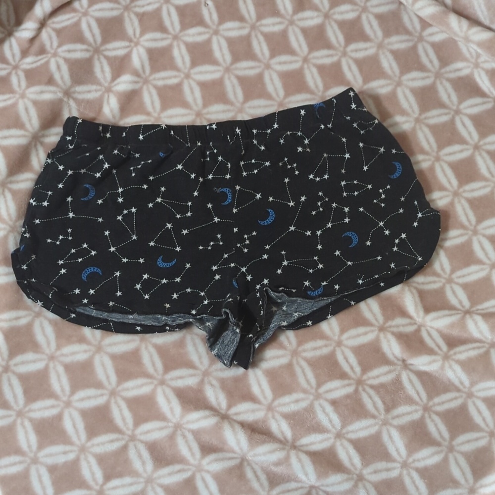 black short, short pajama shorts. They have moons, constellations on theme